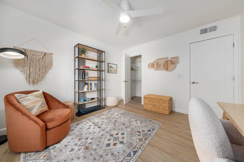 a living room with a couch and a chair